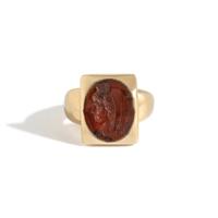 A Roman Carnelian Ring Stone with the Goddess Isis — Set in a gold ring