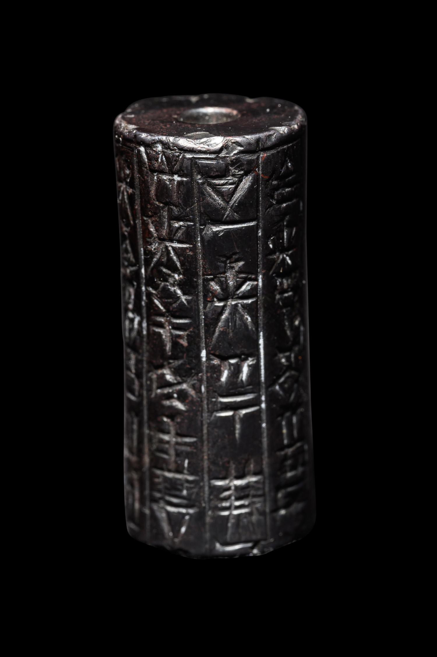 A Mesopotamian Hematite Cylinder Seal