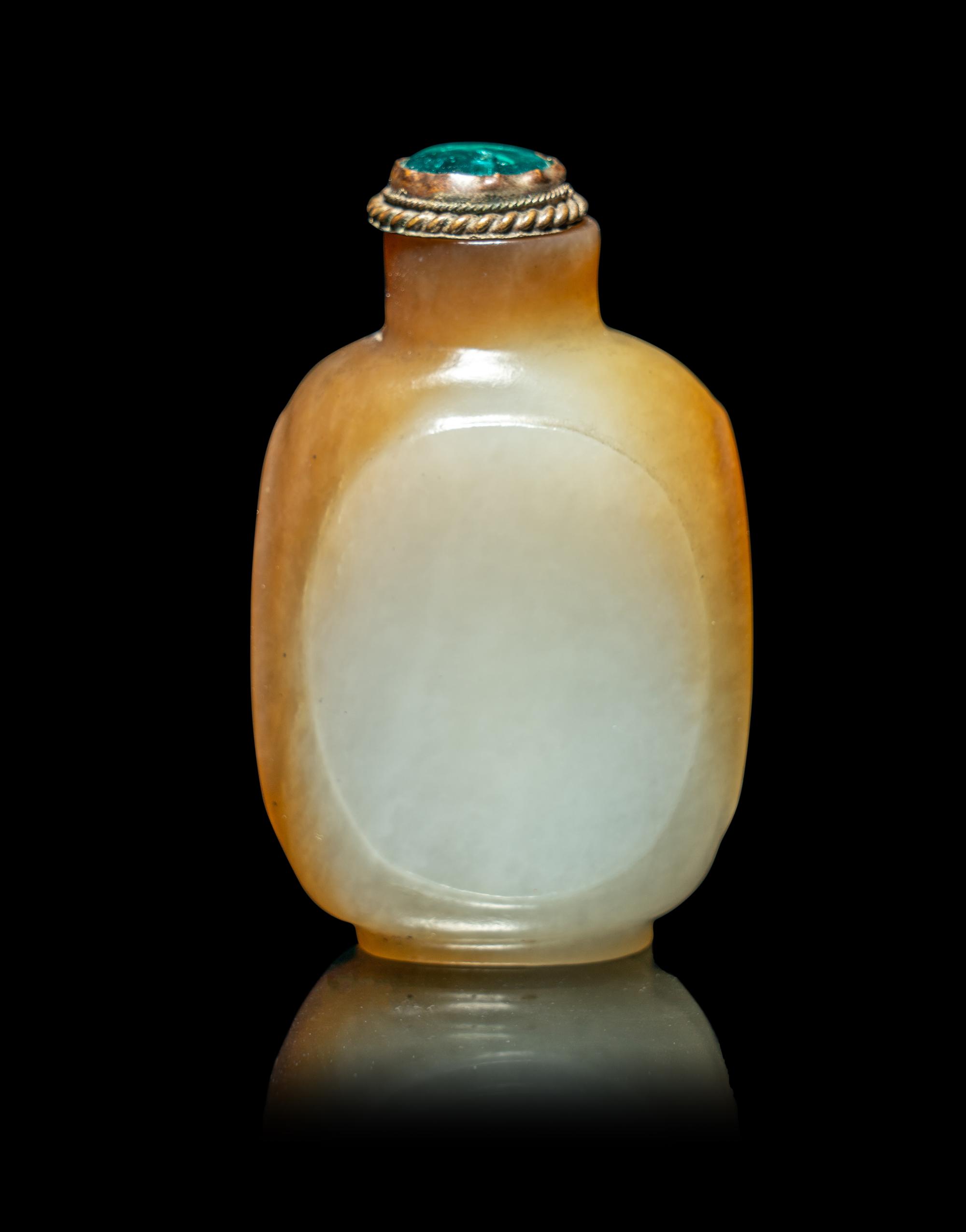 A Chinese Russet and Pale Celadon Jade Snuff Bottle