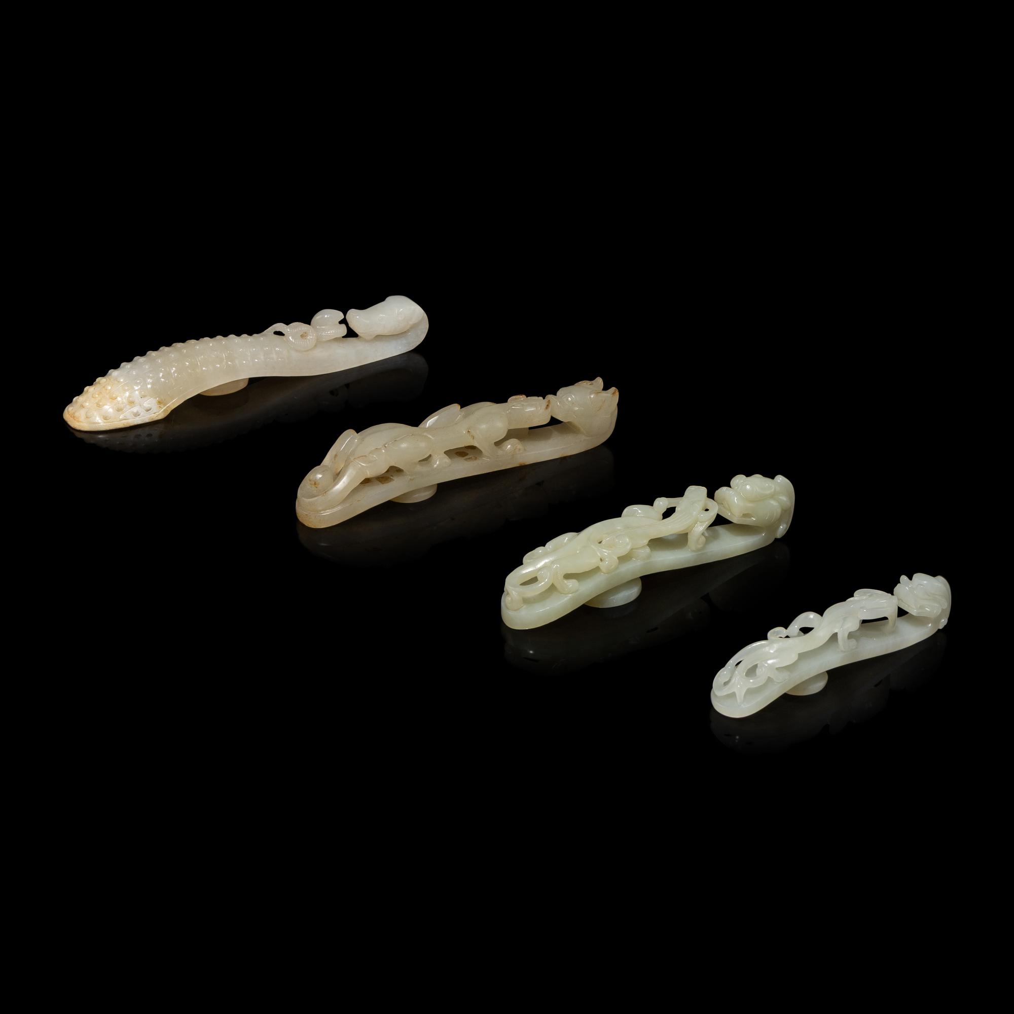 Four Chinese Pale Celadon Jade 'Dragon' Belt Hooks, Daigou — 青白玉龍鈎四枚
