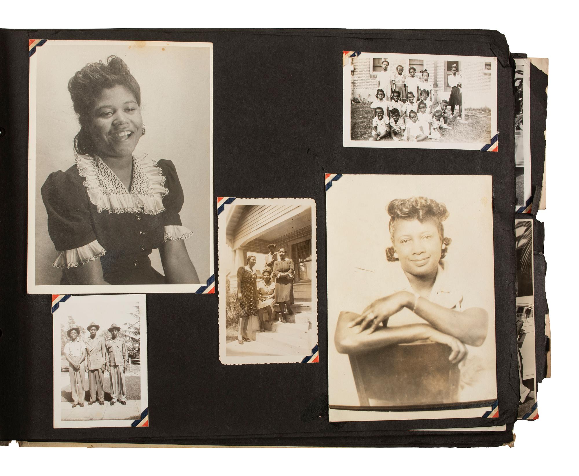[AFRICAN AMERICANA - EARLY PHOTOGRAPHY]. A group of 2 albums containing photographs of African American families, including snapshots of civilians and soldiers. Ca 1930s-1940s.