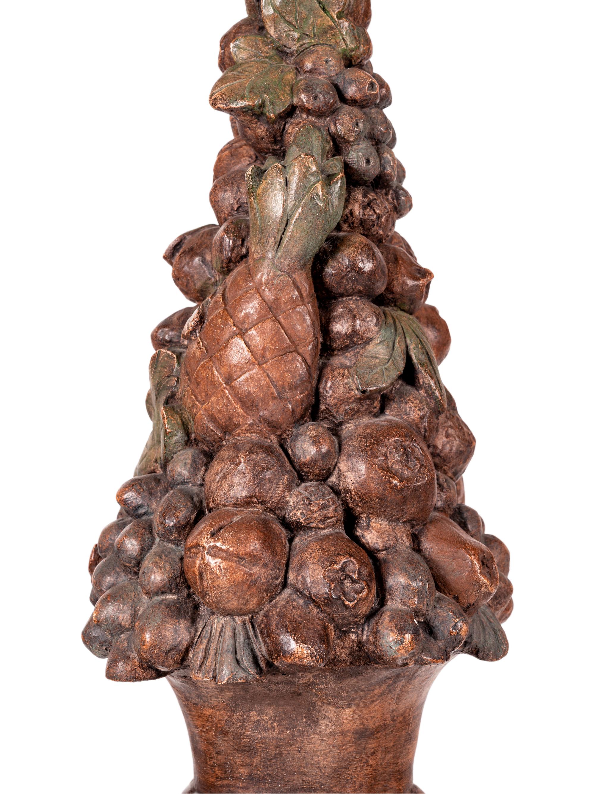 A Pair of Italian Baroque Style Painted Terra Cotta and Carved Wood Pedestals