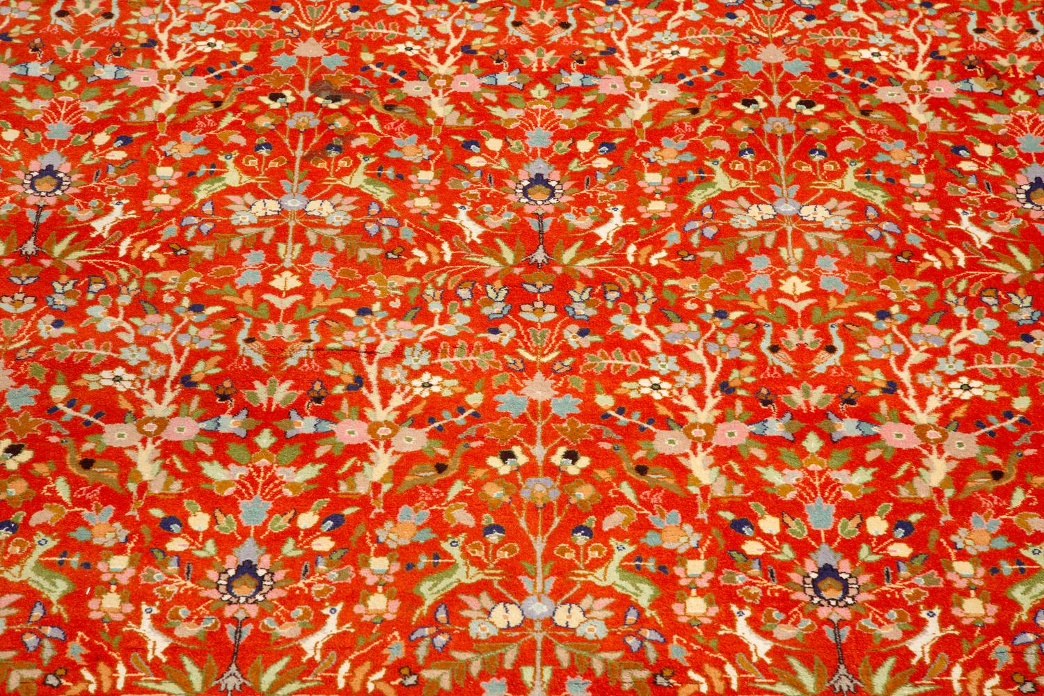 A Tabriz Hunting Design Border Wool Rug