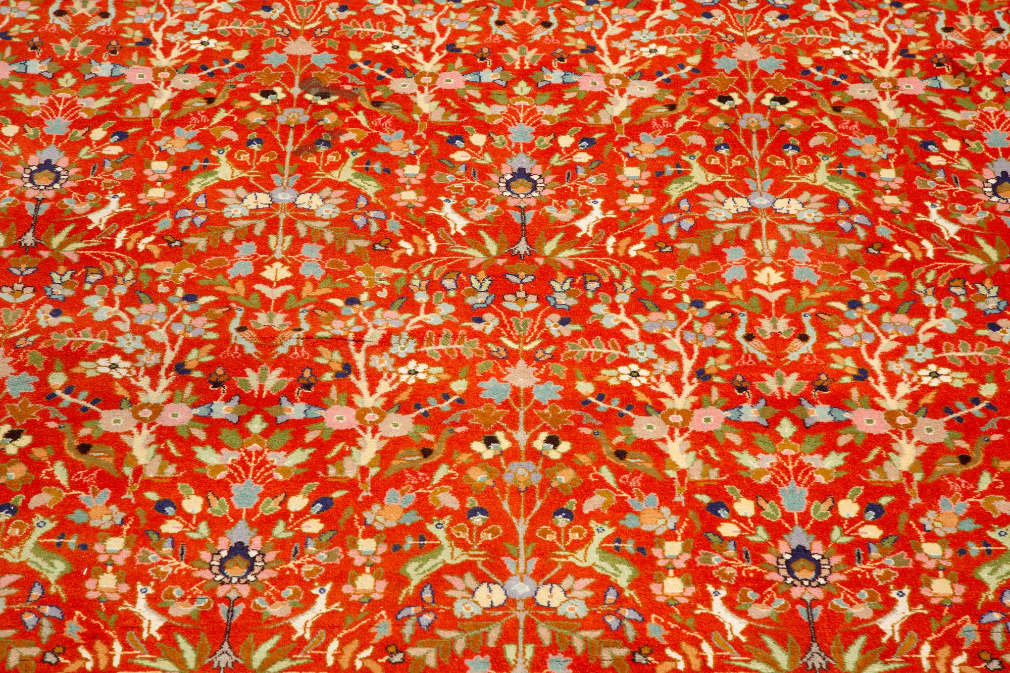 A Tabriz Hunting Design Border Wool Rug