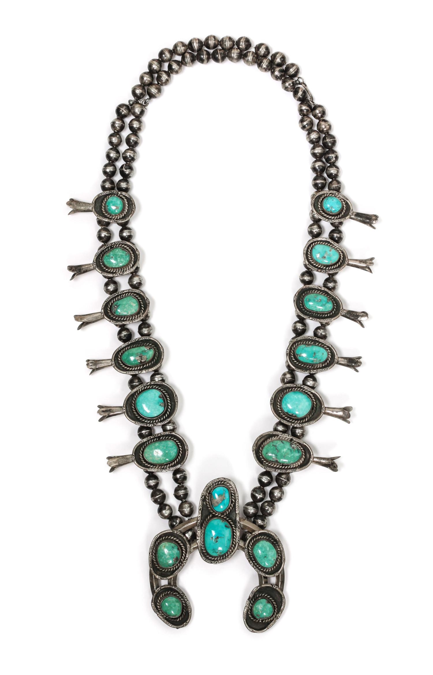 A Southwestern Silver and Turquoise Squash Blossom Necklace Length 22 inches; naja height 3 1/2 x width 3 inches.