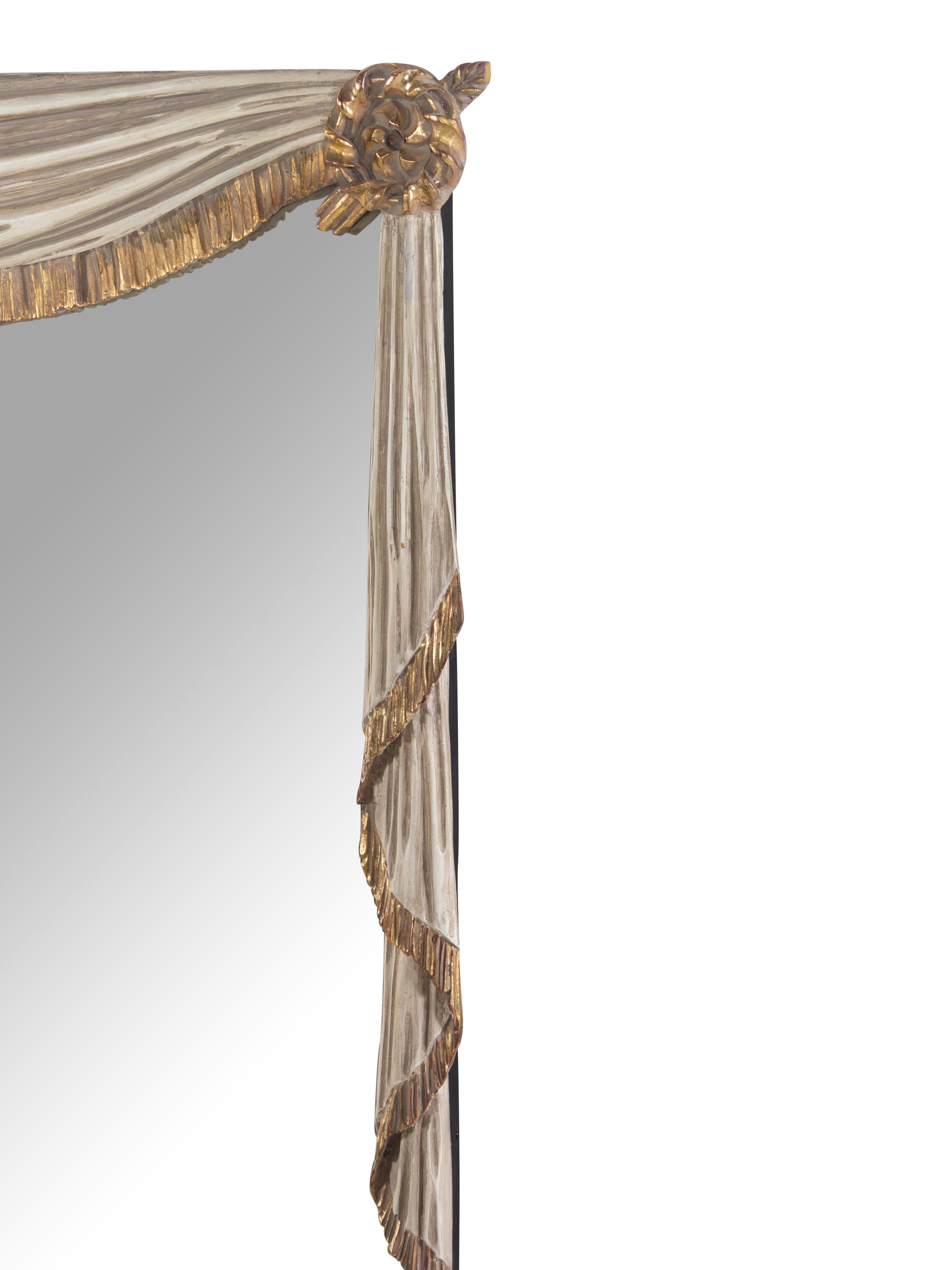 A White Painted and Parcel Gilt Trompe L'Oeil Mirror with Swagged Drapery