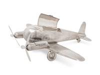A Large Silvered Metal Airplane-Form Table Top Smoking Set