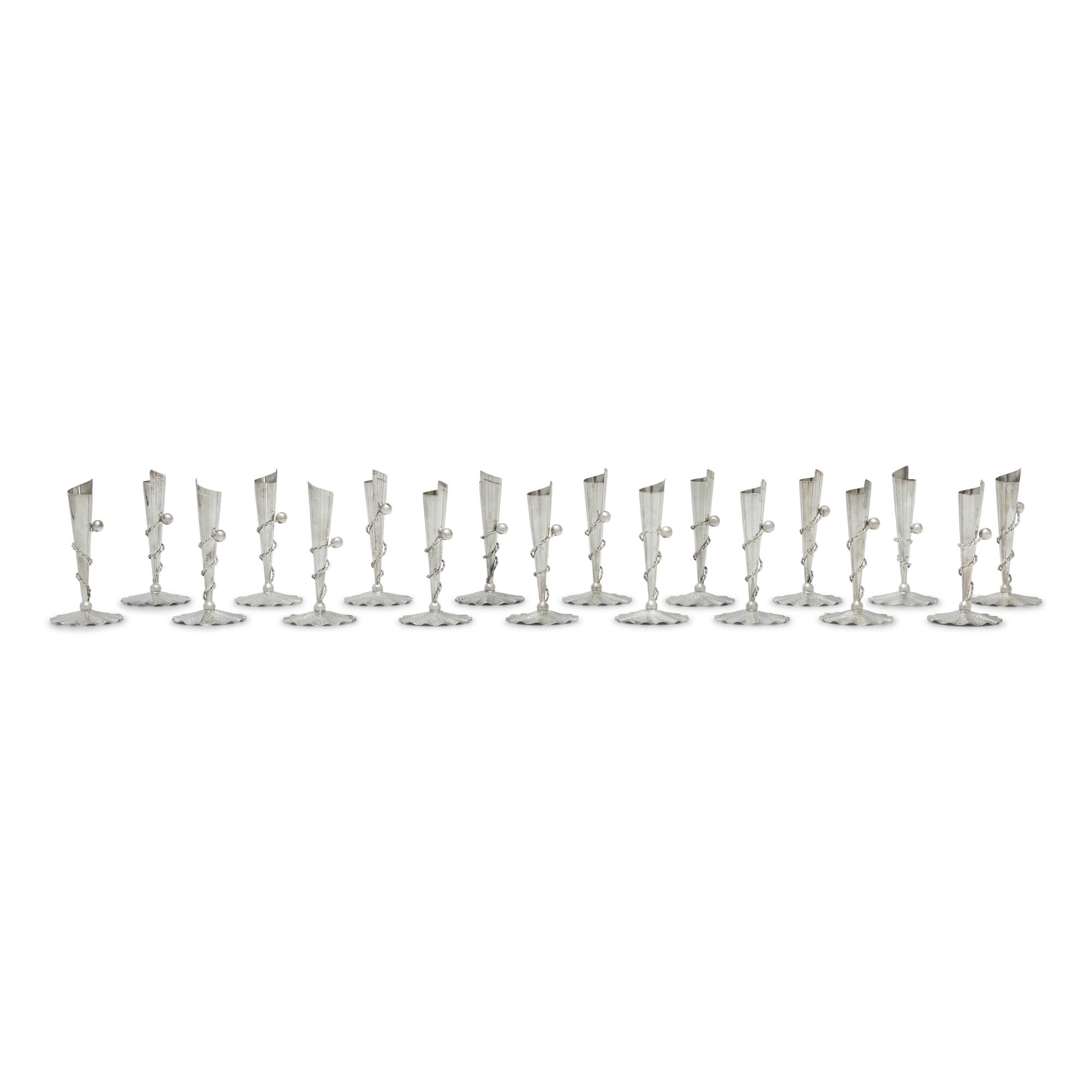 A Set of Eighteen Peruvian Silver Tapersticks