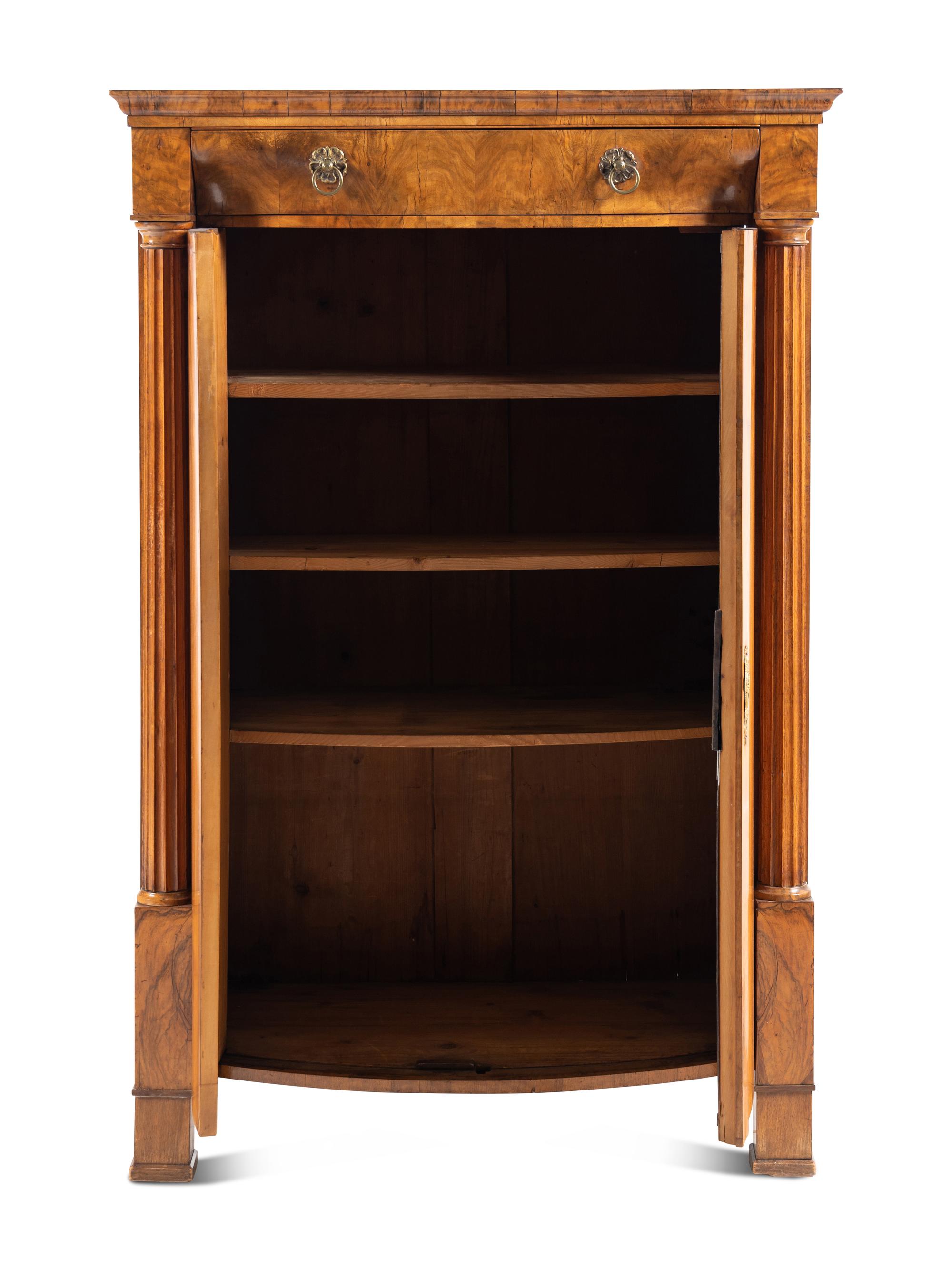 A Biedermeier Figured Walnut Cabinet