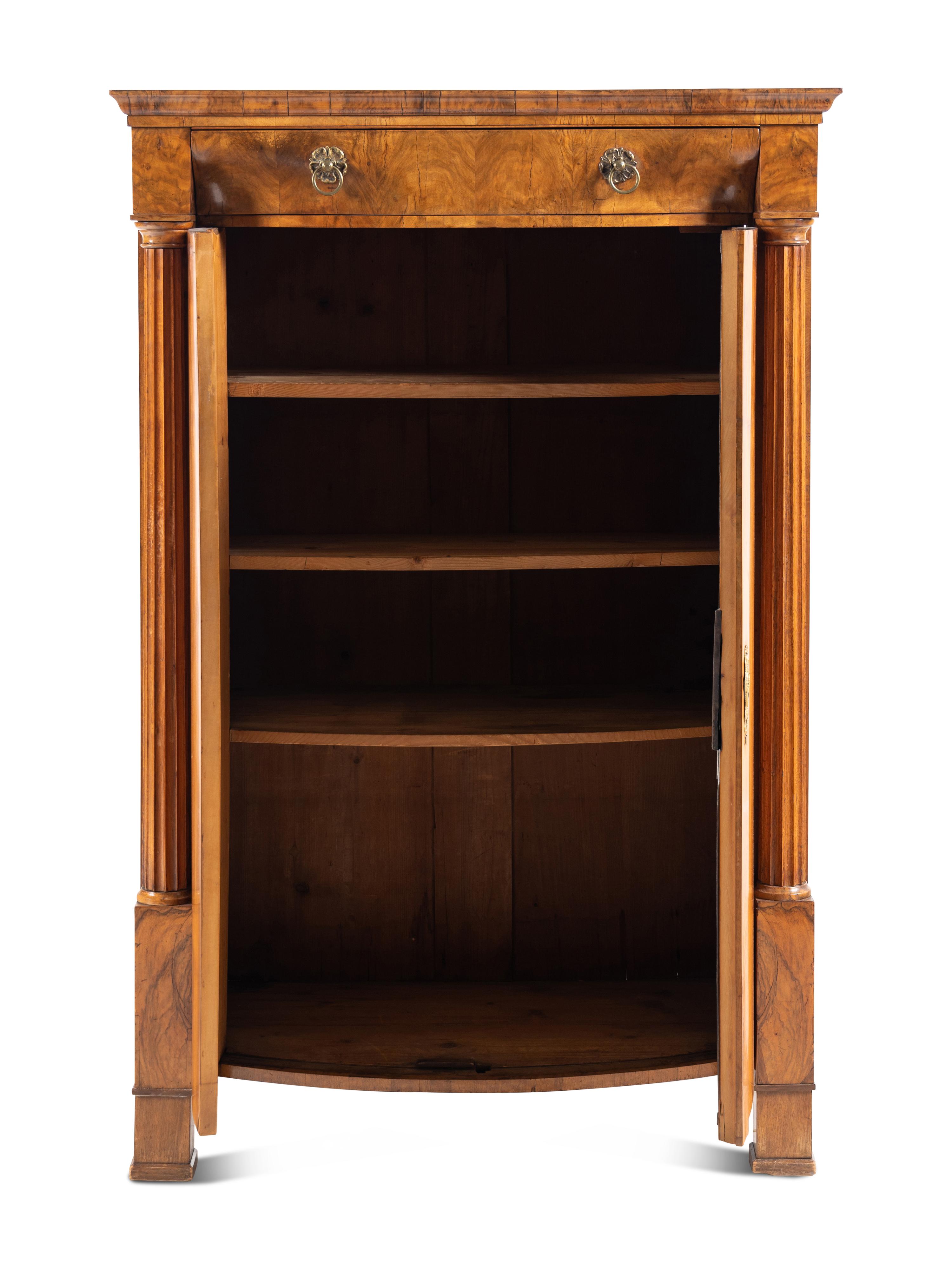 A Biedermeier Figured Walnut Cabinet