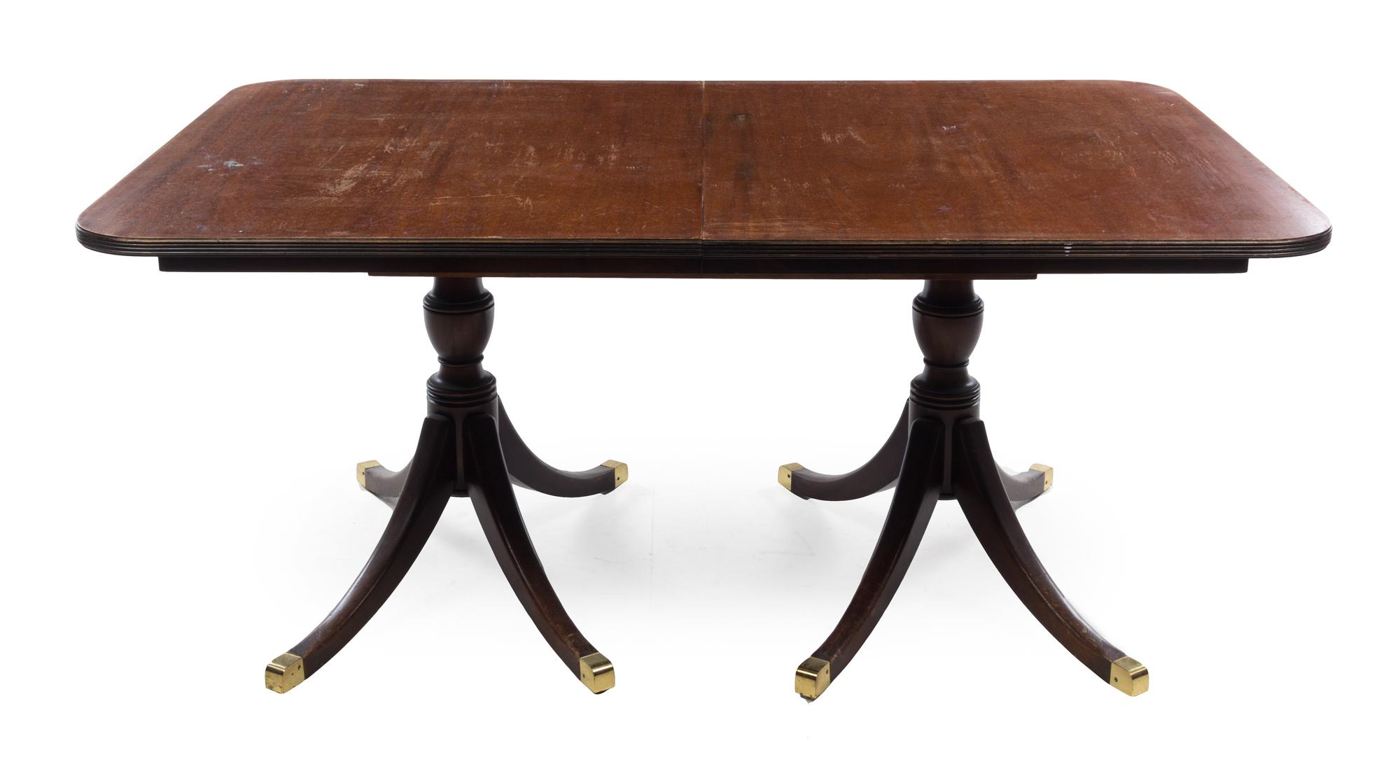 A Regency Style Mahogany Dining Table Height 29 x width 66 x depth 41 inches. — 20TH CENTURY