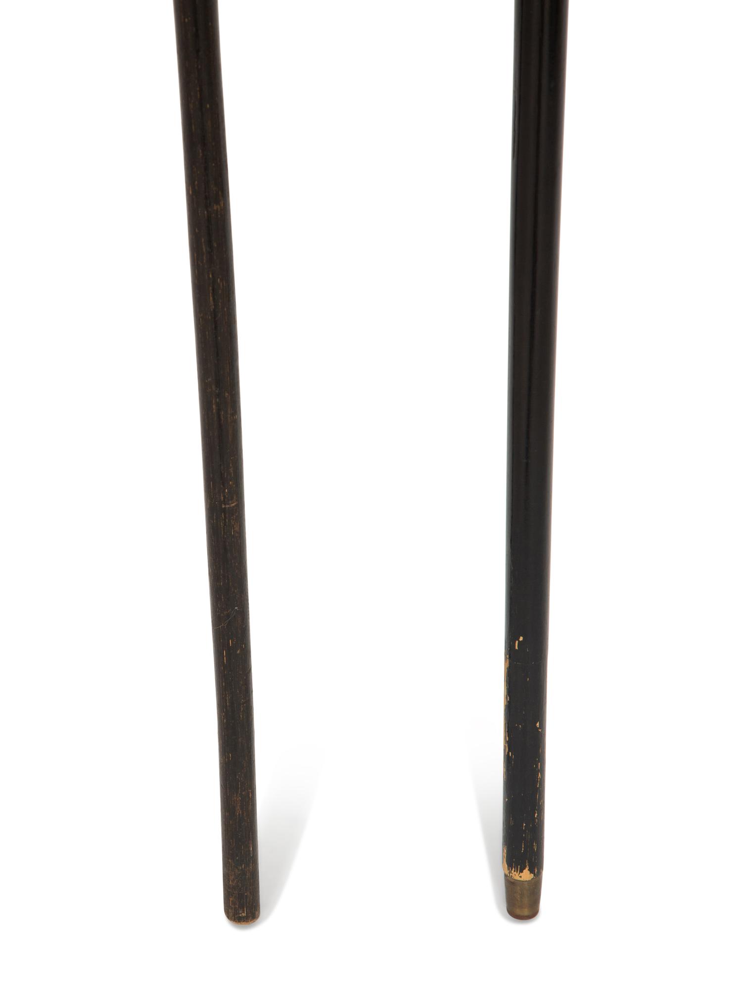 Two Ebonized Walking Sticks with Zoomorphic Handles