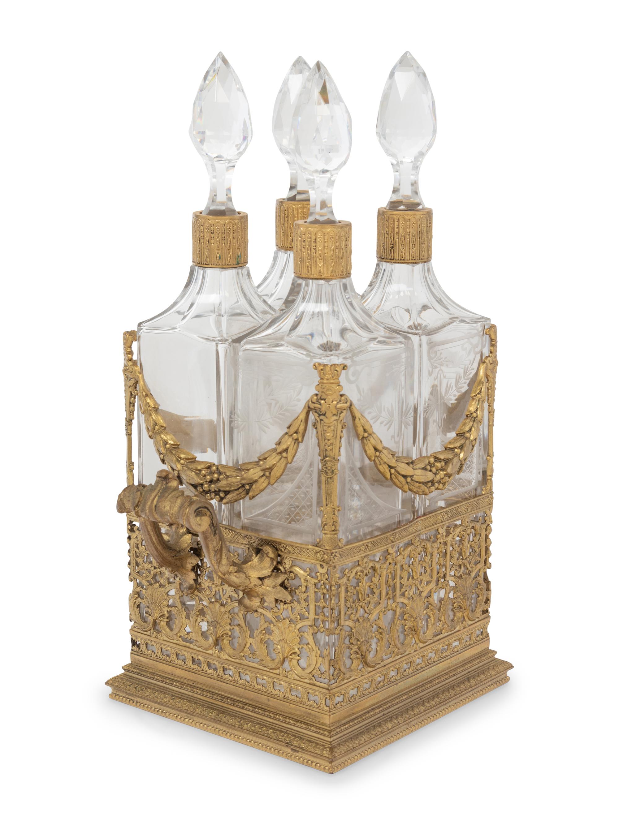 A French Gilt Metal and Glass Four-Bottle Decanter Caddy