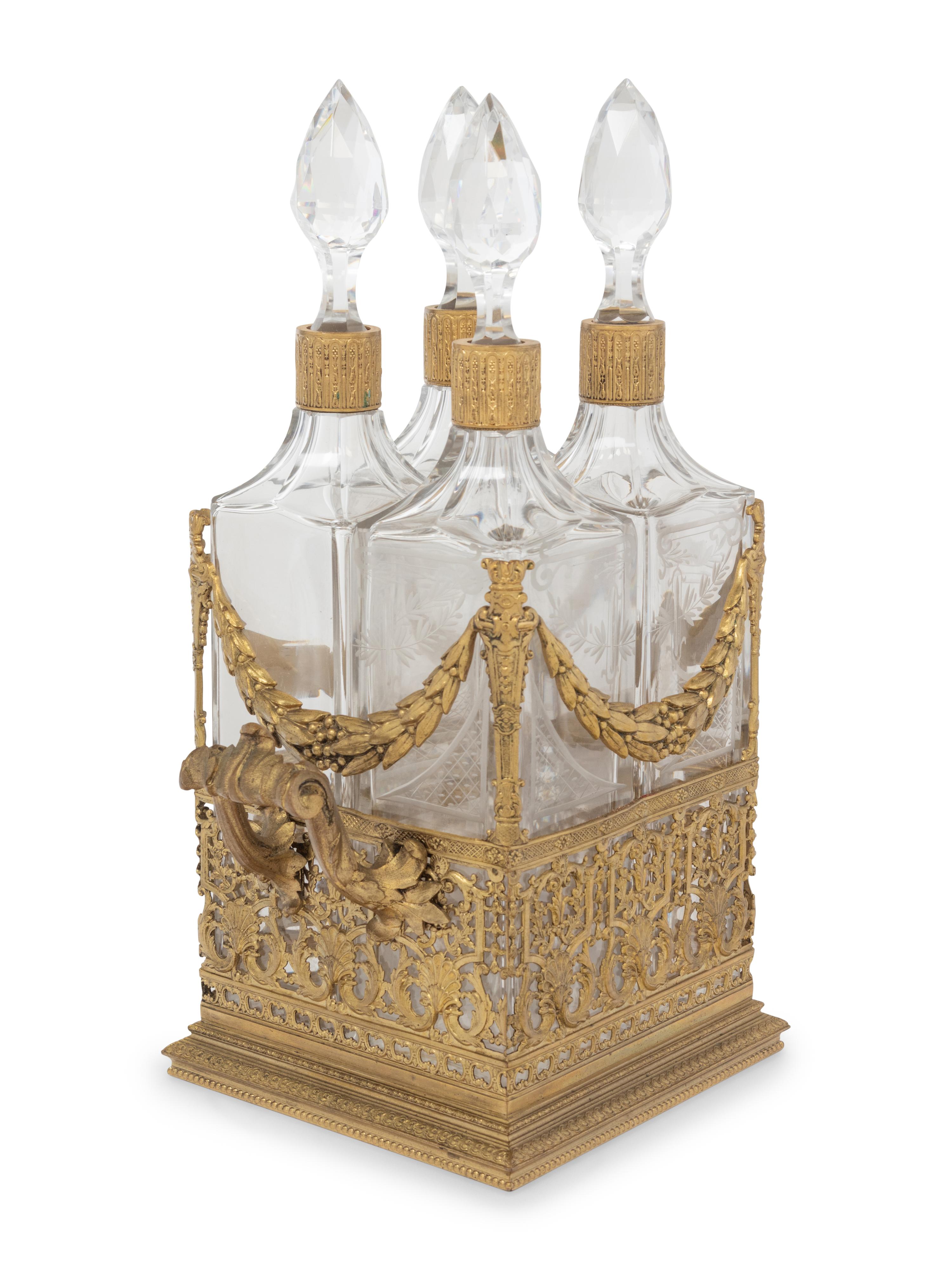 A French Gilt Metal and Glass Four-Bottle Decanter Caddy