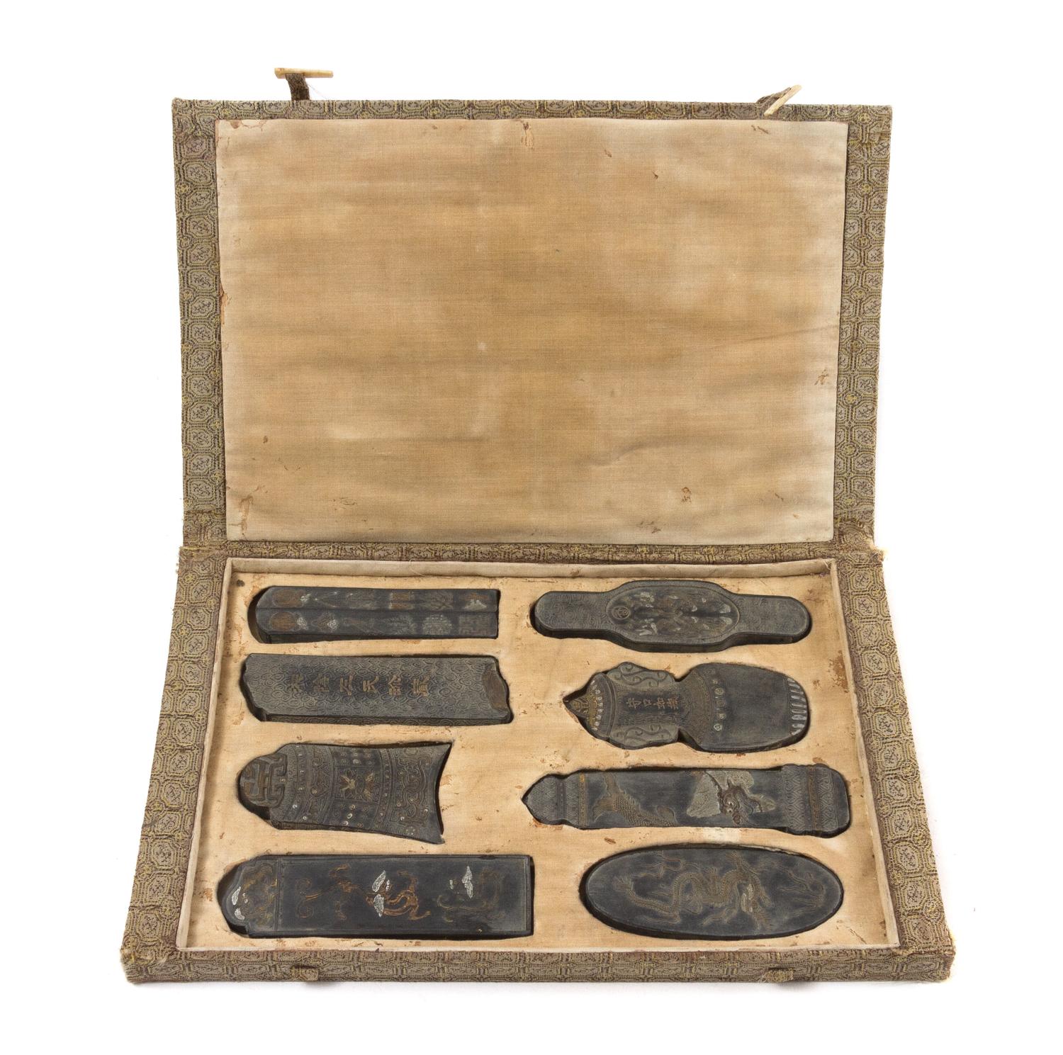 A Set of Eight Ink Cakes Length of longest 5 1/8 inches.