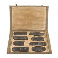 A Set of Eight Ink Cakes Length of longest 5 1/8 inches.