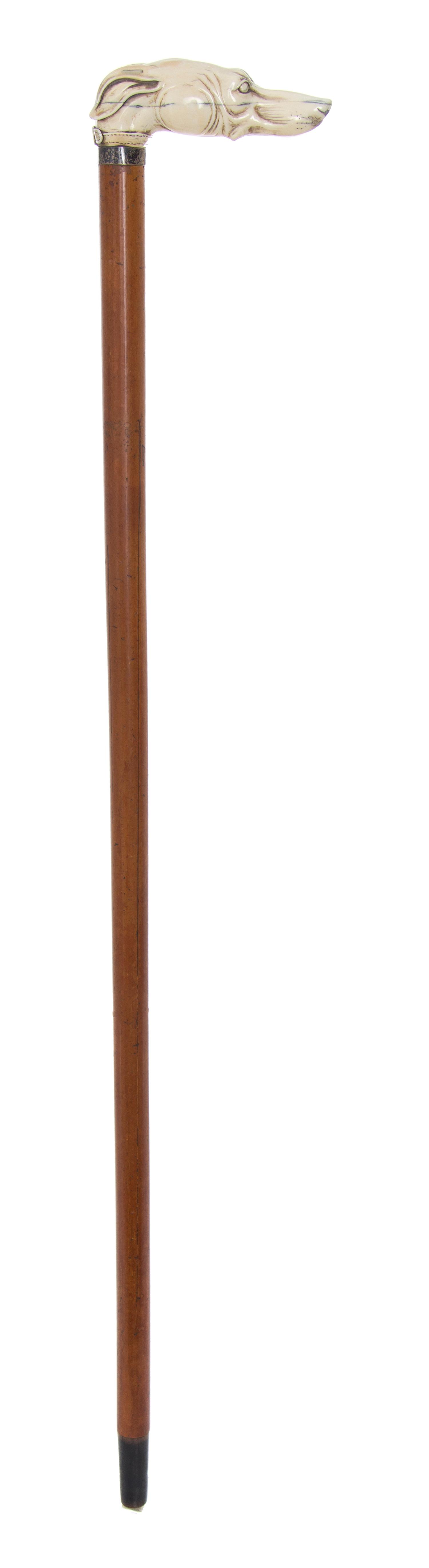 An English Ivory Handled Cane, Length of handle 4 3/4 x length overall 32 1/4 inches.