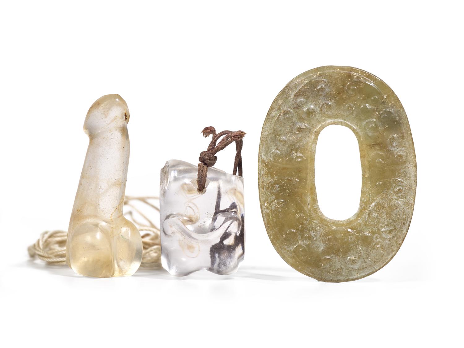 A Rock Crystal "Knucklebone", a Glass Phallus and a Chinese Archaistic Jade Ring