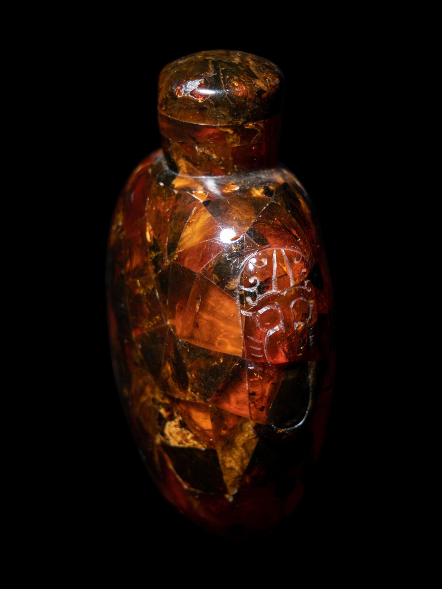 Three Chinese Red Peking Glass Snuff Dishes and A Plastic Imitating Amber Snuff Bottle