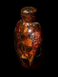 Three Chinese Red Peking Glass Snuff Dishes and A Plastic Imitating Amber Snuff Bottle