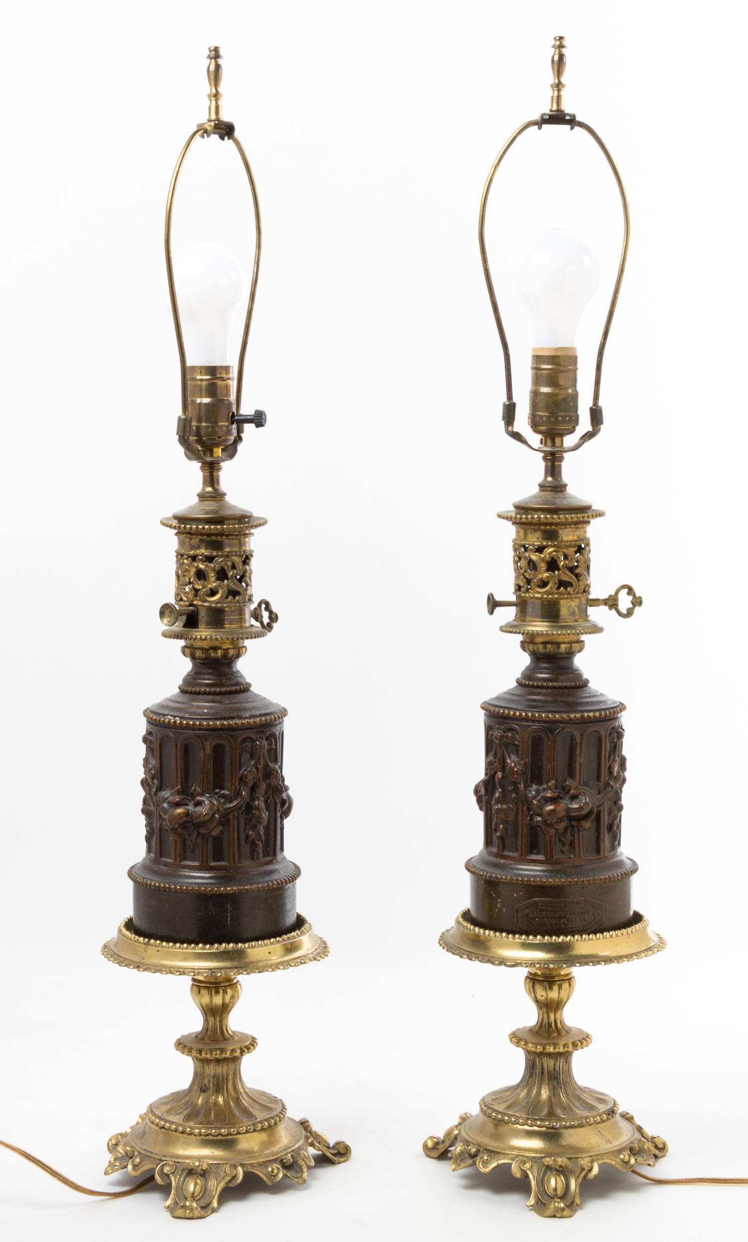 A Pair of Gilt and Patinated Metal Oil Lamp Bases Height overall 29 1/2 inches. — 20TH CENTURY