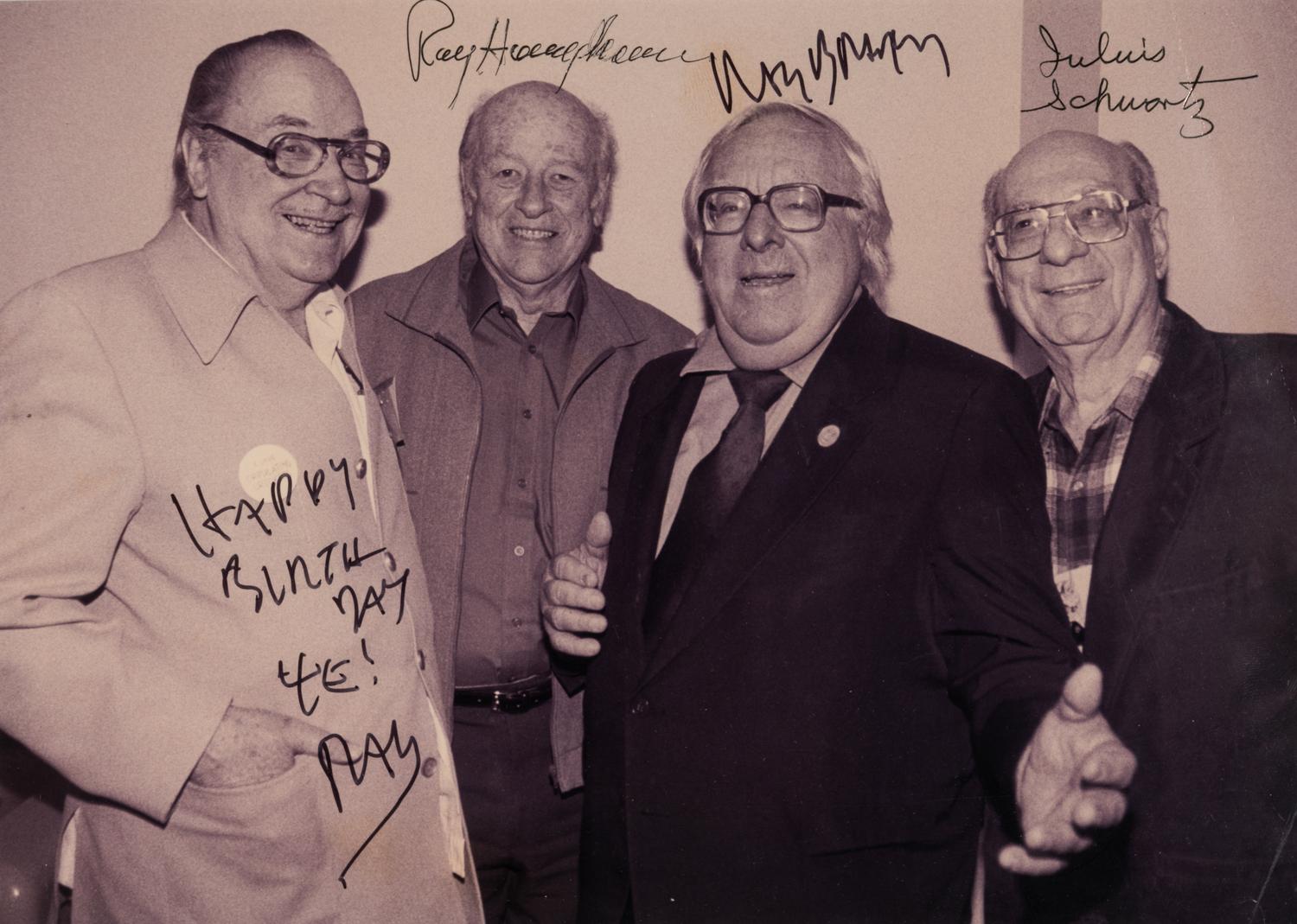 [SCIENCE FICTION]. Signed photograph of Forrest J. Ackerman, Ray Bradbury, Ray Harryhausen, and Julius Schwartz. Ca. 2001.
