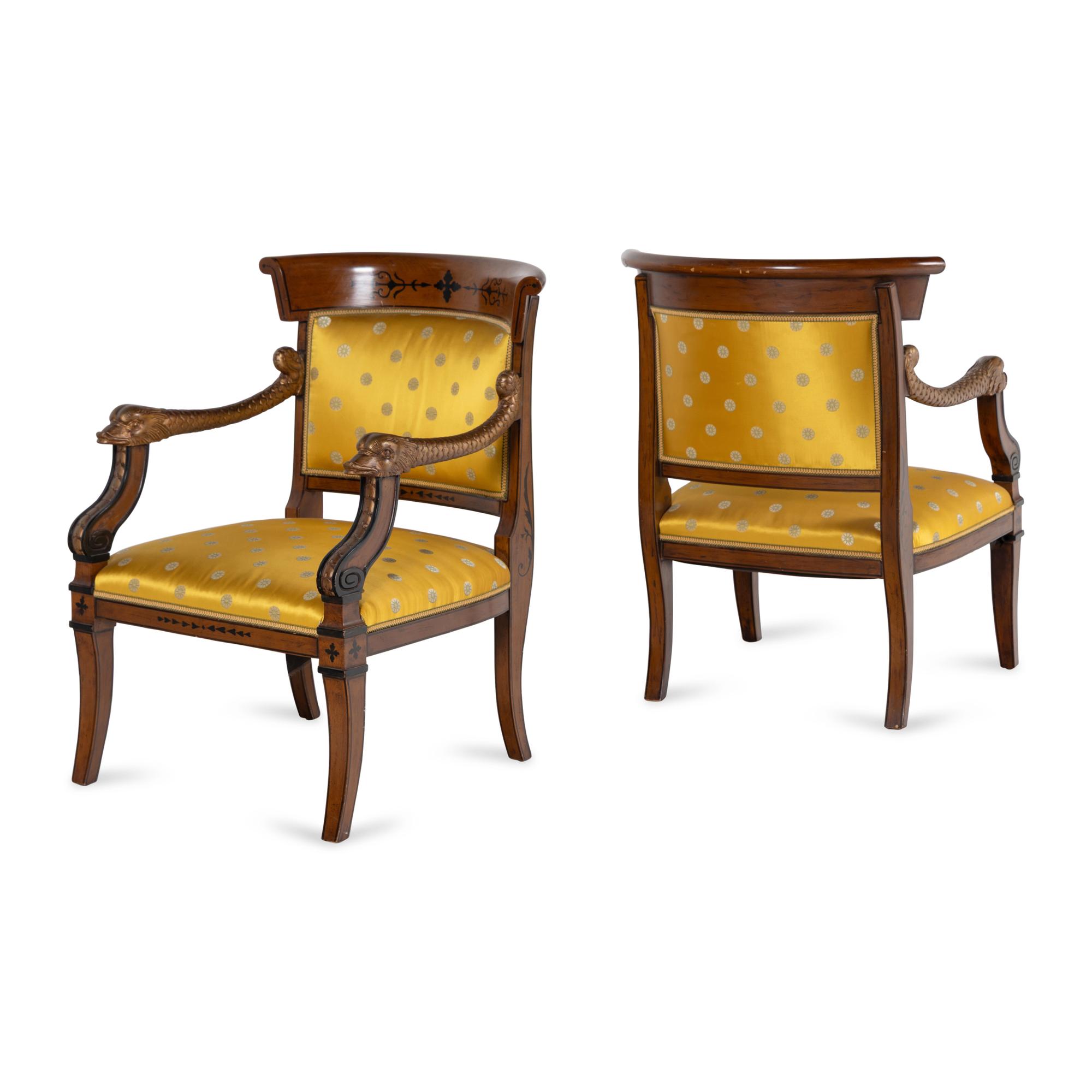 A Pair of Charles X Style Parcel-Gilt and Part Ebonized Armchairs