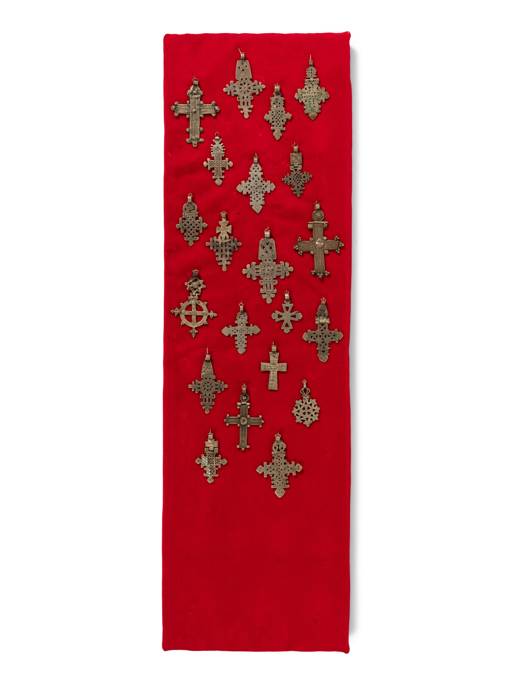 A Collection of Pewter Cross Pendants