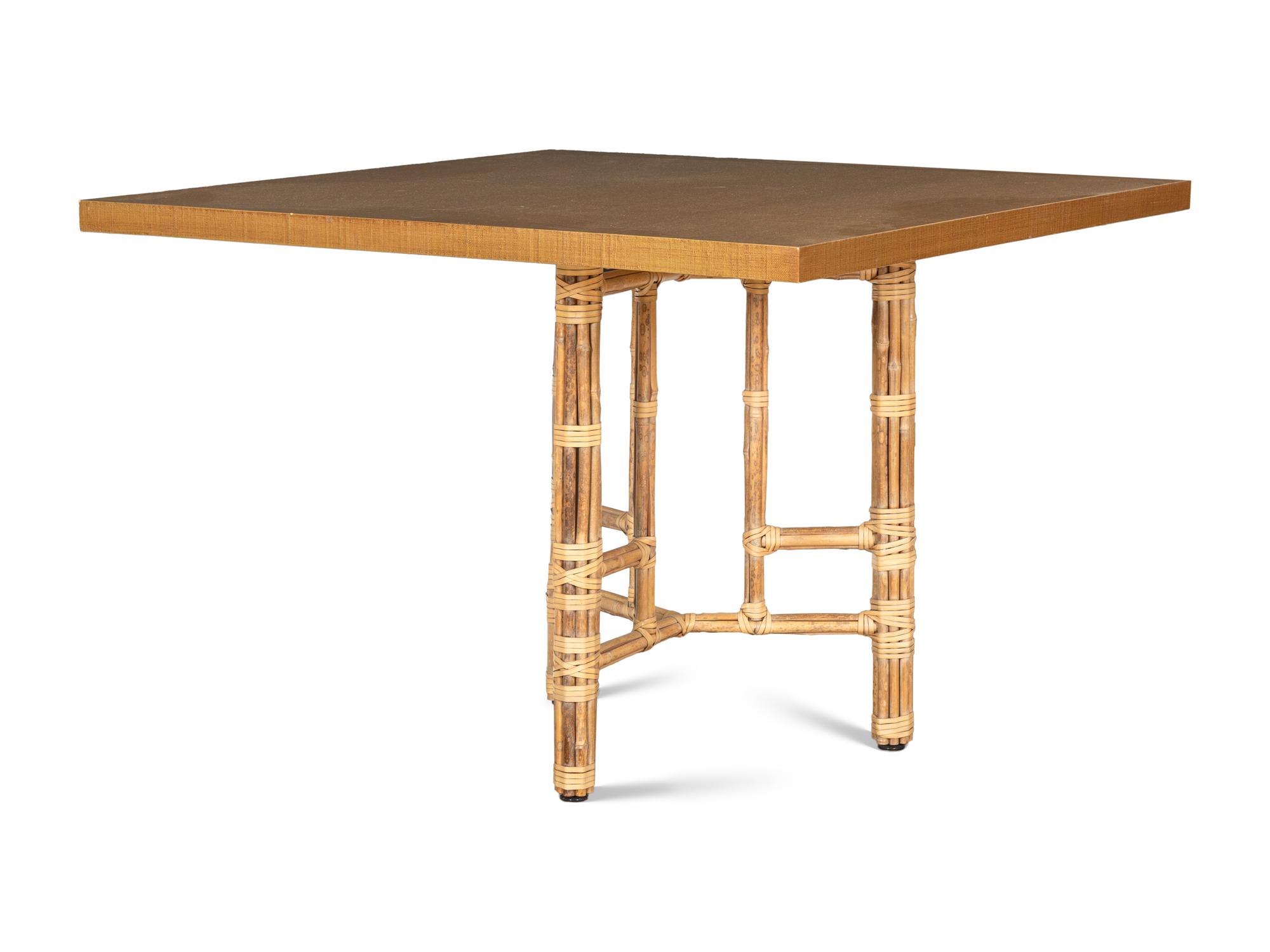 A Set of Four McGuire Rattan Target Armchairs and an Organic Bamboo Table