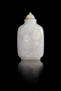 A Carved White Jade Snuff Bottle Height 3 inches.