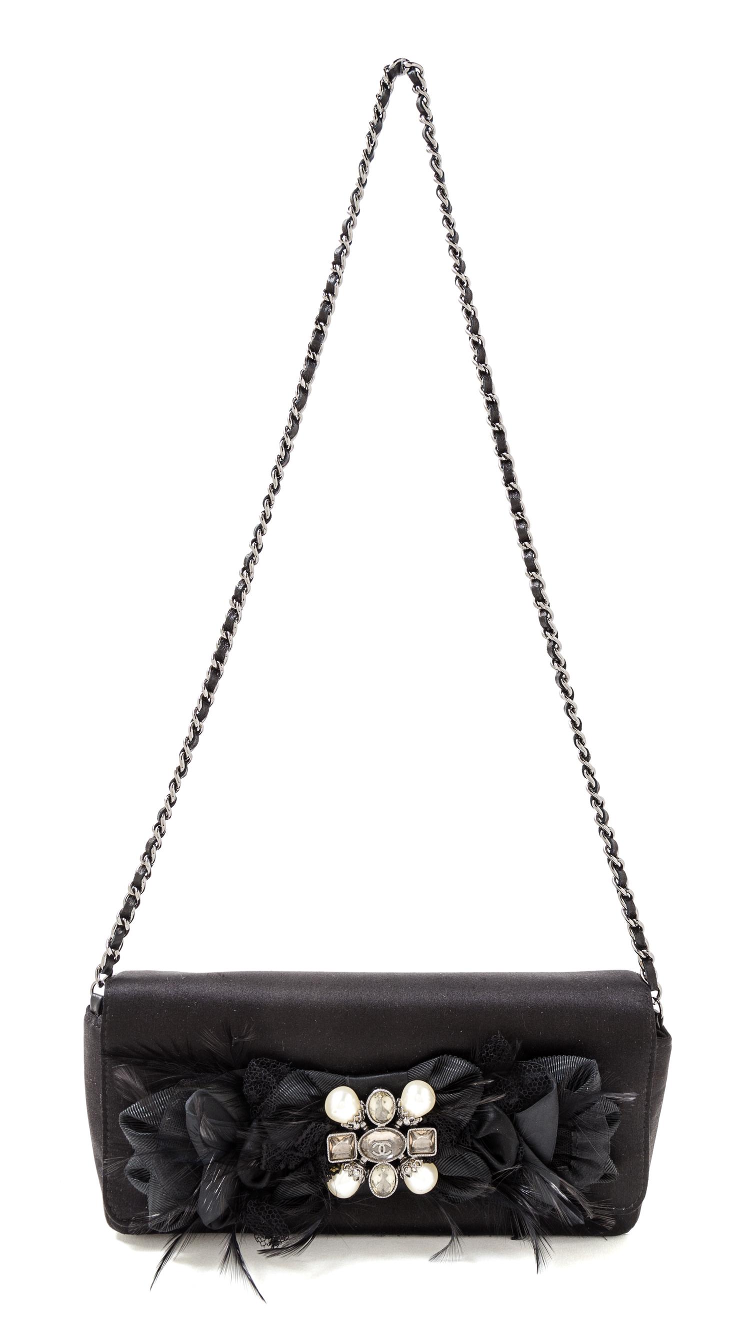 A Chanel Black Satin Evening Handbag, 9.5" x 4.75" x 1.25"; Strap drop 15.5''.