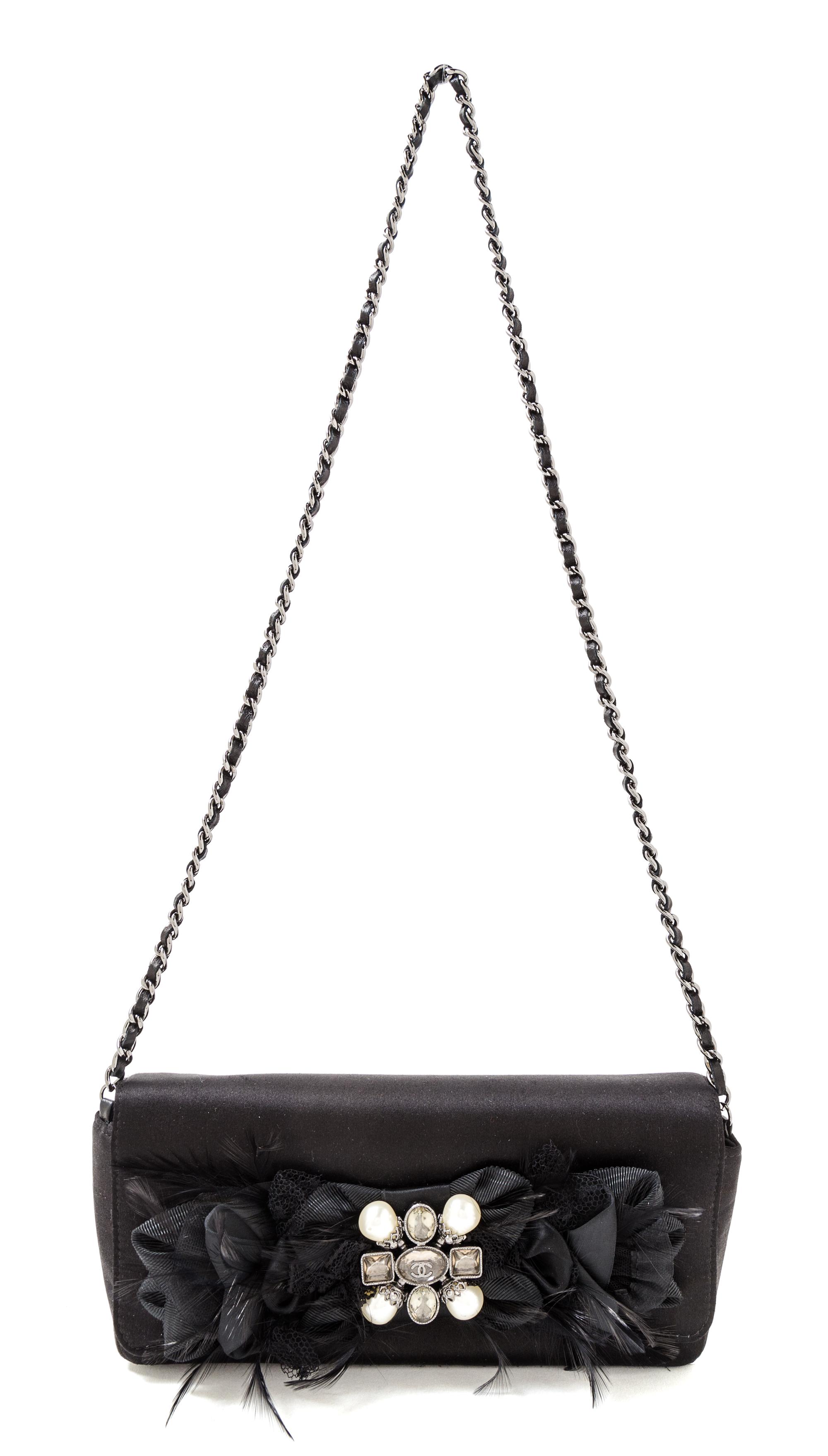 A Chanel Black Satin Evening Handbag, 9.5" x 4.75" x 1.25"; Strap drop 15.5''.