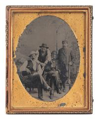 [EARLY PHOTOGRAPHY]. Half plate postwar tintype portrait of 4 men, one of whom is armed.
