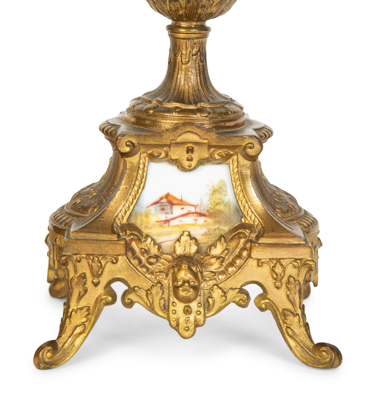 A Pair of Sèvres Style Porcelain Small Urns with Gilt Metal Mounts