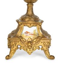 A Pair of Sèvres Style Porcelain Small Urns with Gilt Metal Mounts