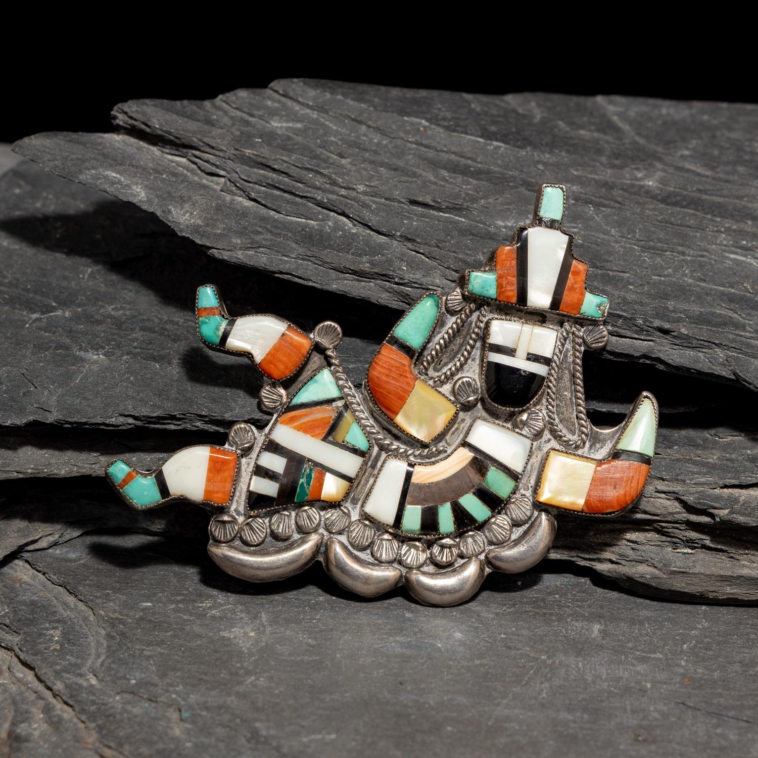 Neva Gilicion and Juanita Lamy (Zuni, 20th century) — Mosaic Inlay Rainbow Man Brooch, 1981