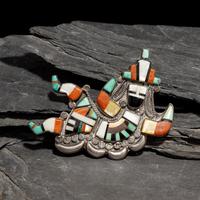 Neva Gilicion and Juanita Lamy (Zuni, 20th century) — Mosaic Inlay Rainbow Man Brooch, 1981