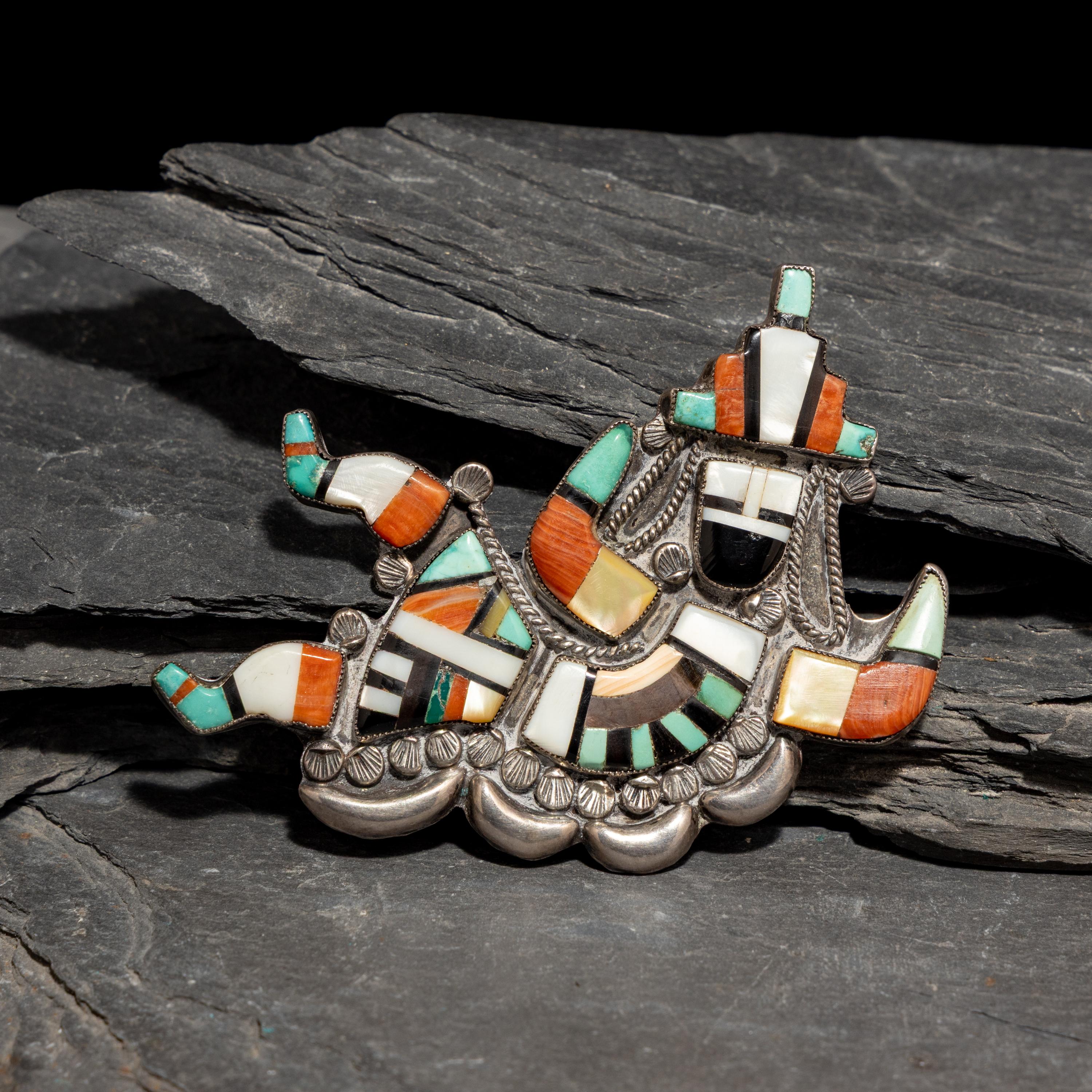 Neva Gilicion and Juanita Lamy (Zuni, 20th century) — Mosaic Inlay Rainbow Man Brooch, 1981