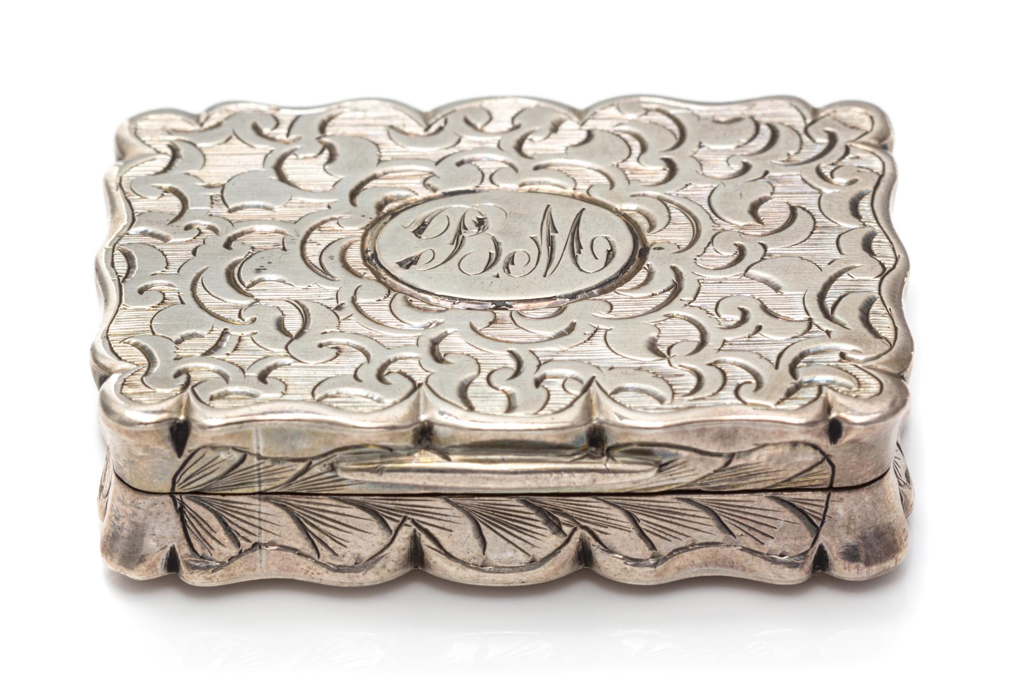 A Victorian Silver Vinaigrette, Frederick Marson, Birmingham, 1857, the case worked with floral decoration, the lid centered by a monog