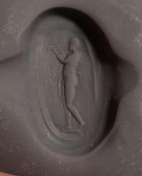 A Roman Carnelian Ring Stone with the God Silenus Playing an Aulos — Set in a gold ring