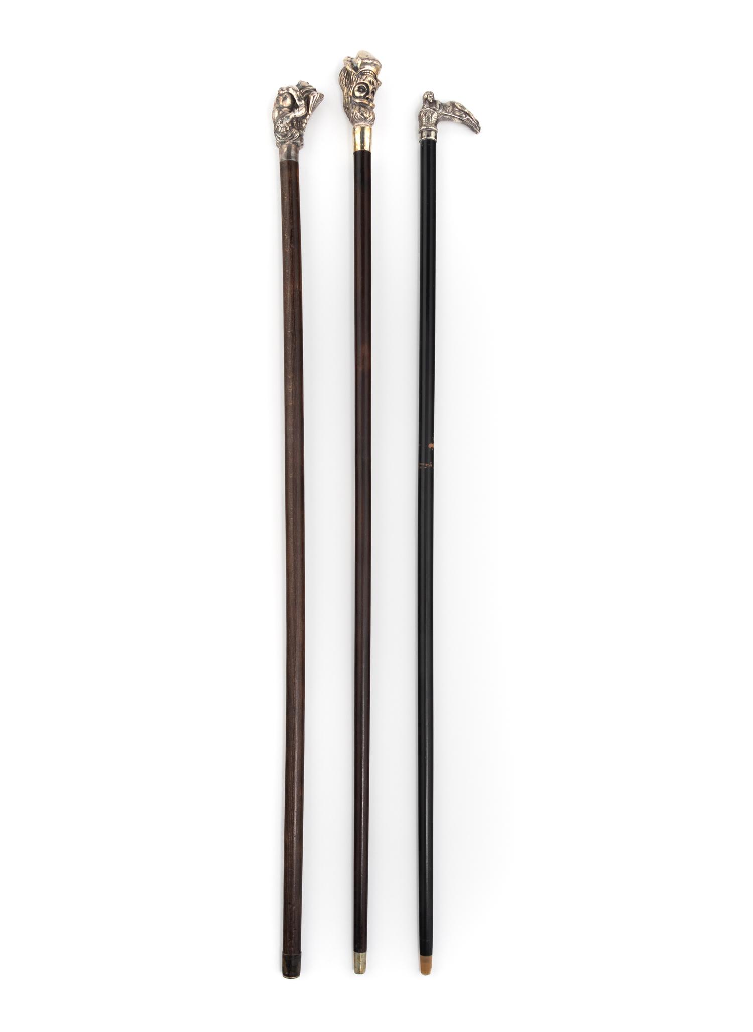 A Group of Three Silver Mounted Figural Walking Sticks