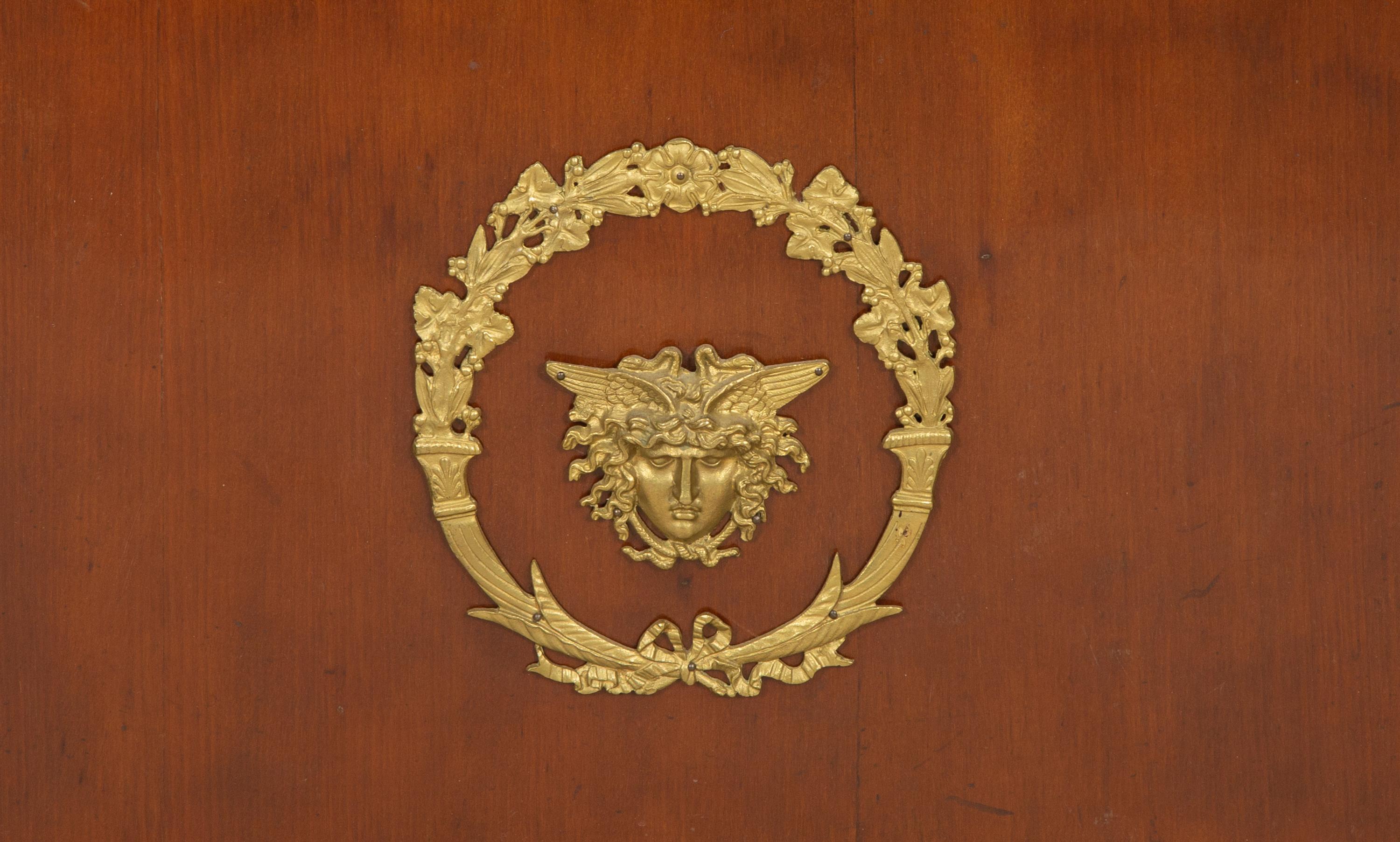 An Empire Style Gilt Metal Mounted Mahogany Bibliothèque