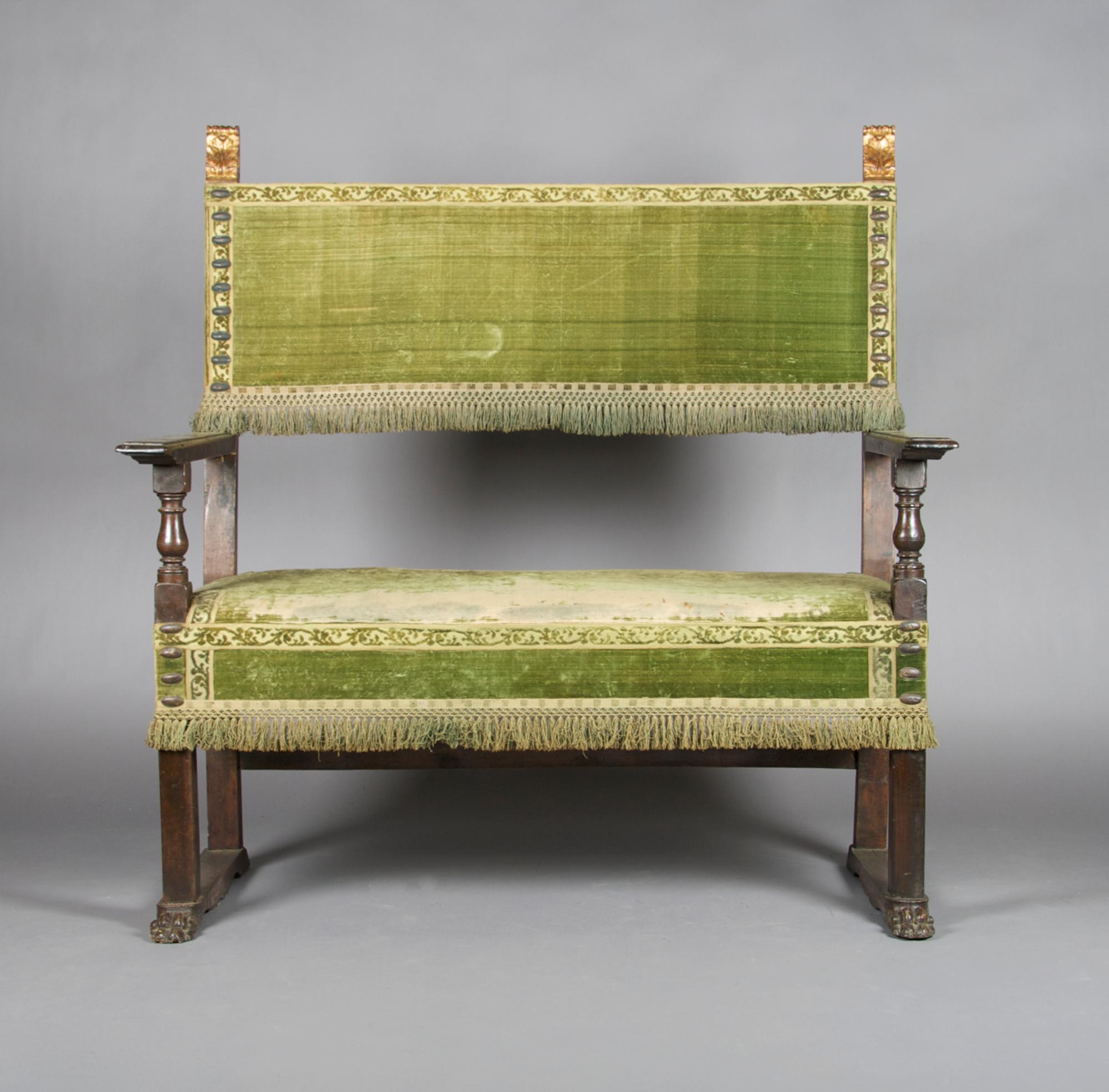 A Renaissance Revival Carved and Parcel Gilt Hall Bench, Height 51 x width 50 1/2 x depth 23 inches.