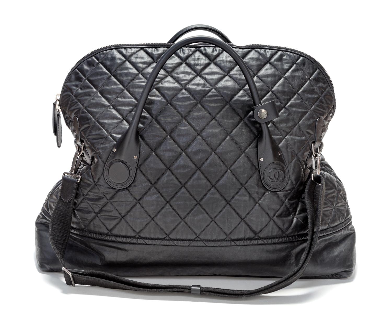 A Chanel Black Quilted Weekender Bag, 27" x 18.5" x 9".