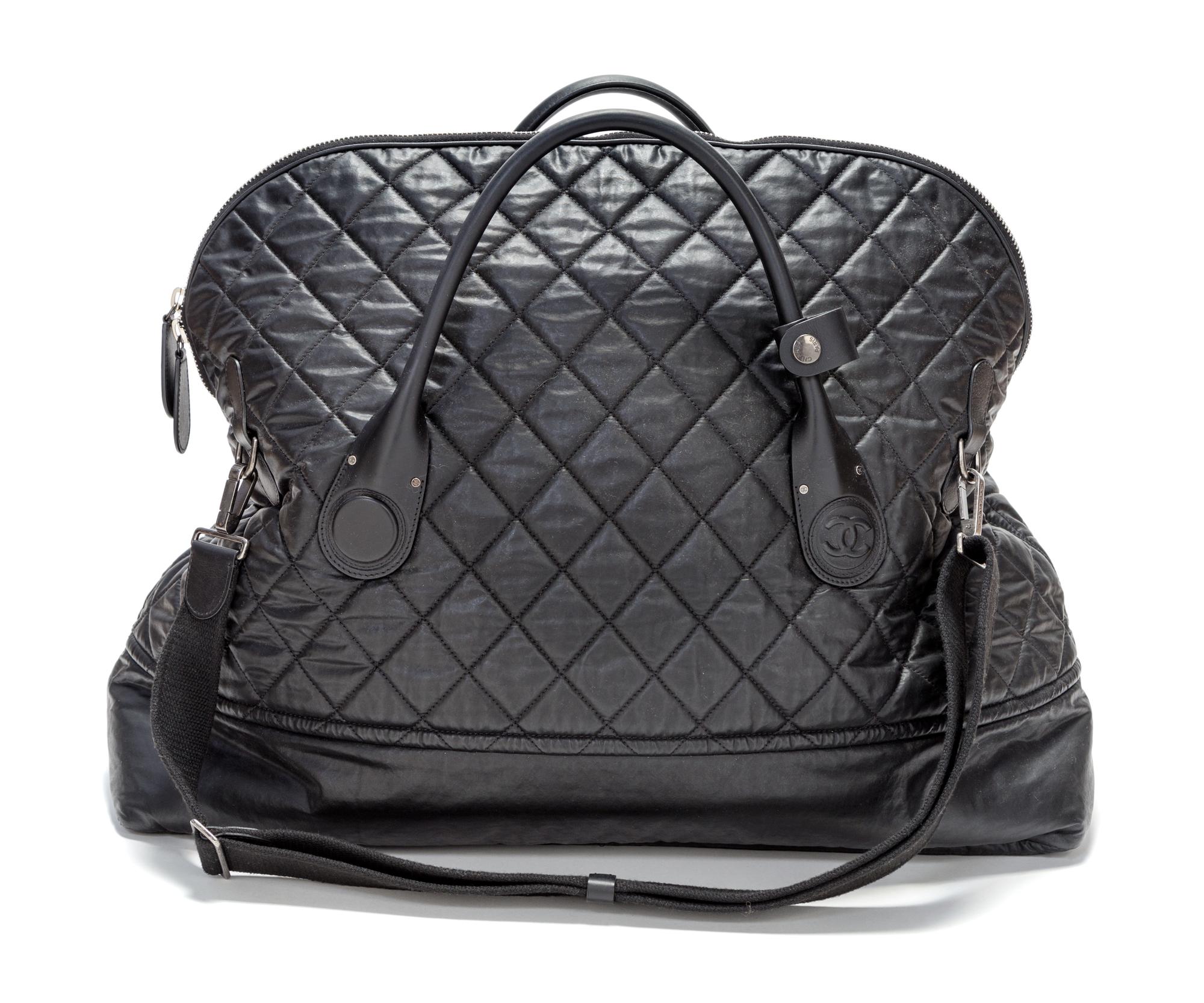 A Chanel Black Quilted Weekender Bag, 27" x 18.5" x 9".