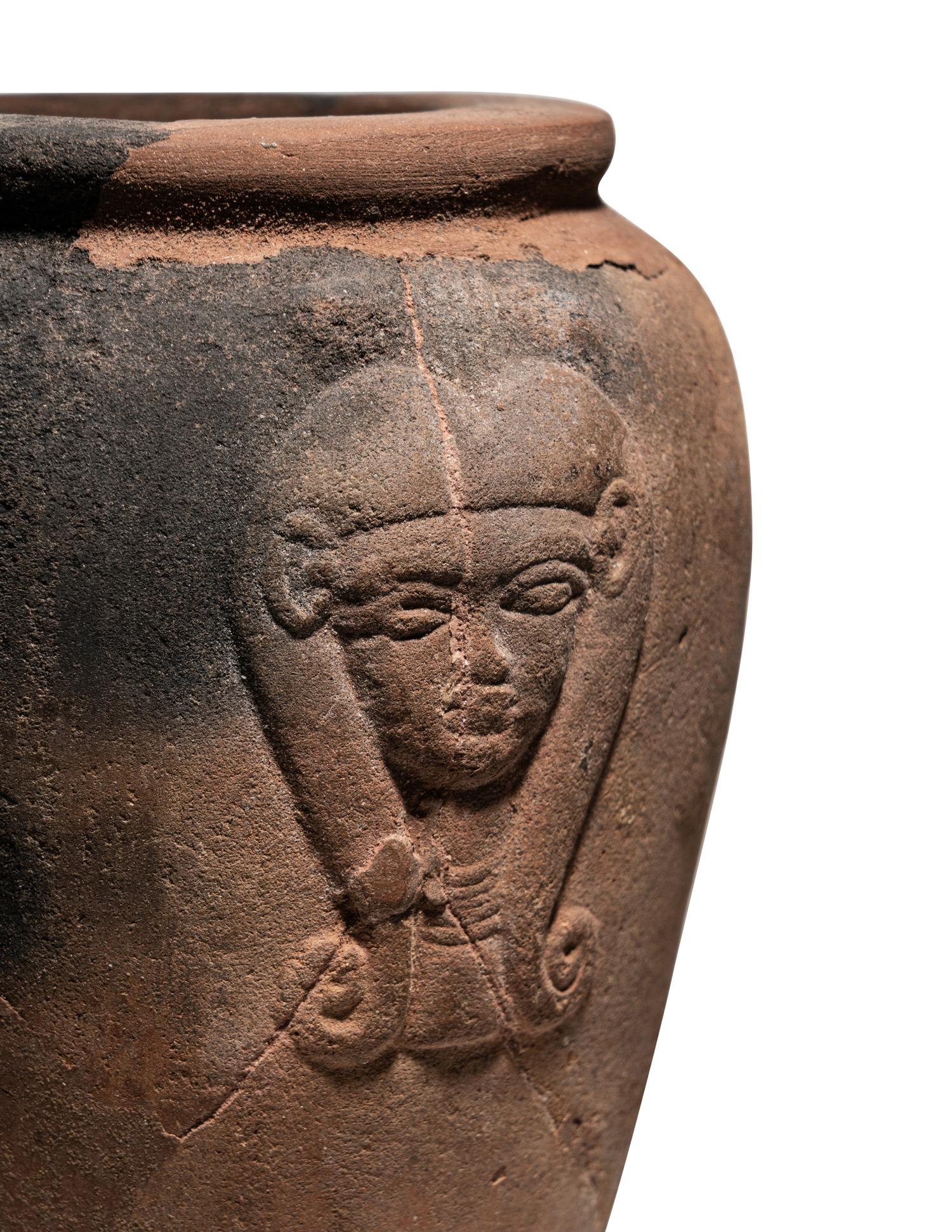An Egyptian Pottery Jar with Head of Hathor