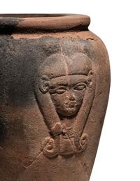 An Egyptian Pottery Jar with Head of Hathor