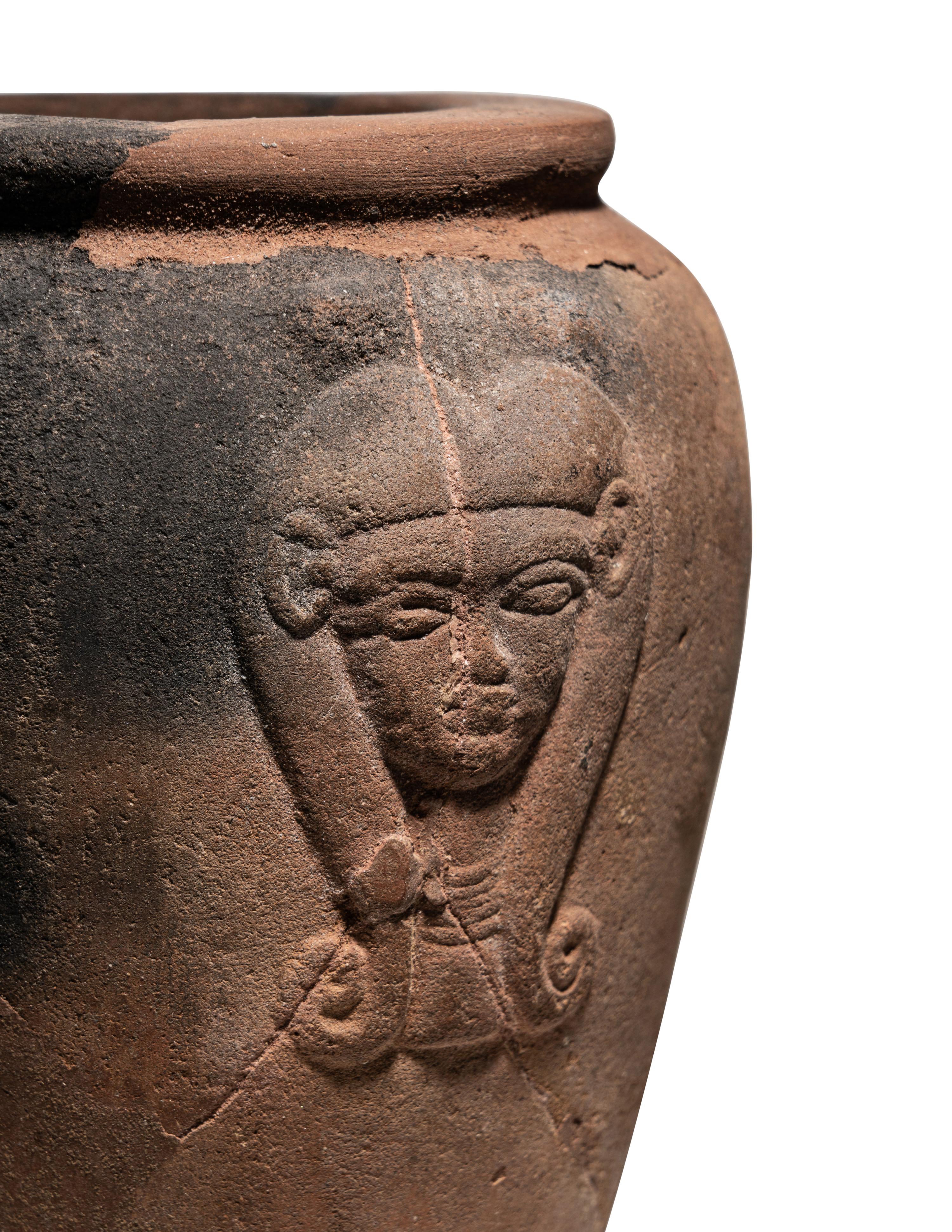 An Egyptian Pottery Jar with Head of Hathor