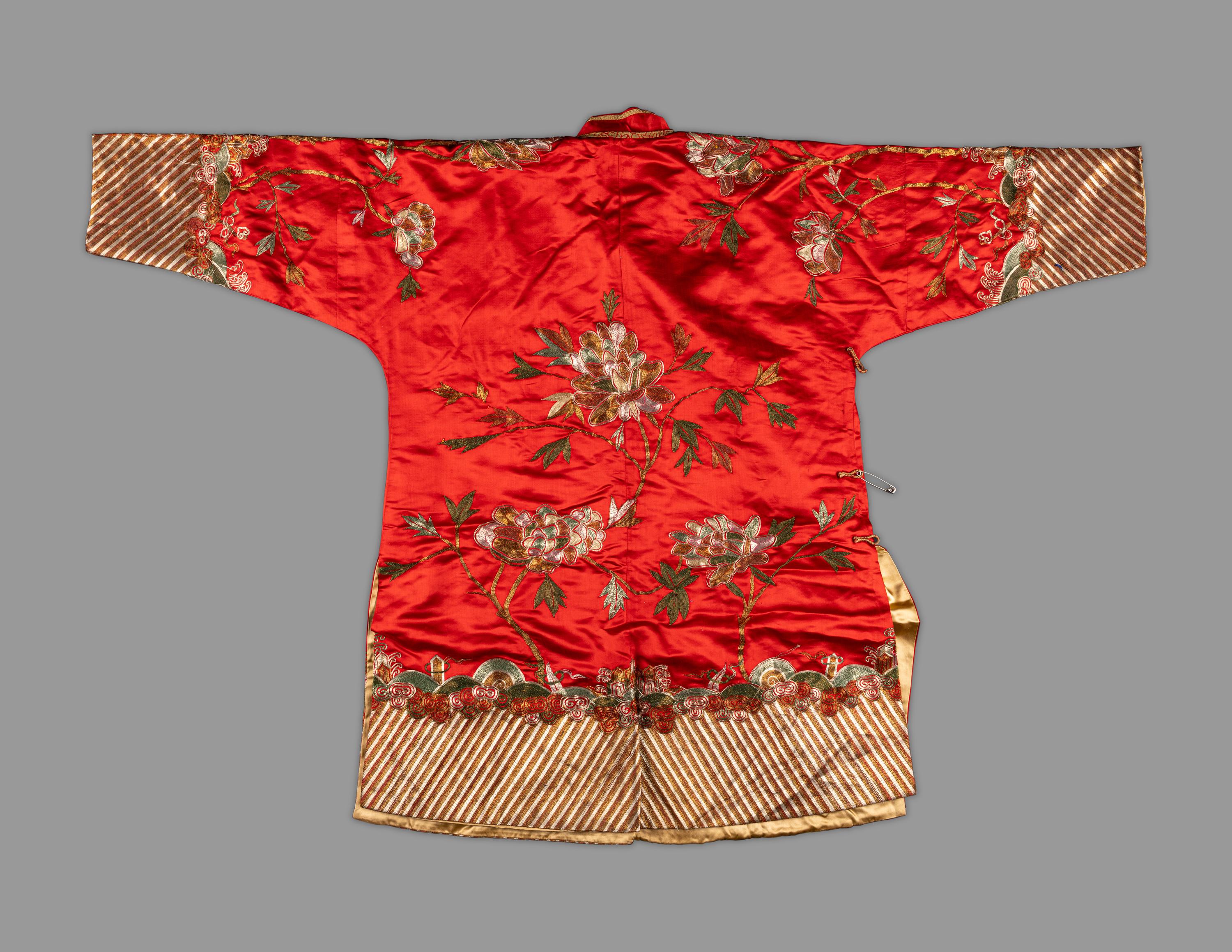 A Chinese Red Ground Embroidered Silk Jacket