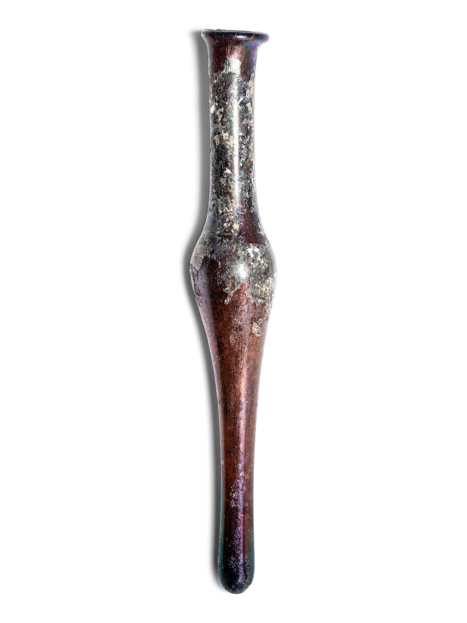 A Roman Aubergine Glass Unguentarium